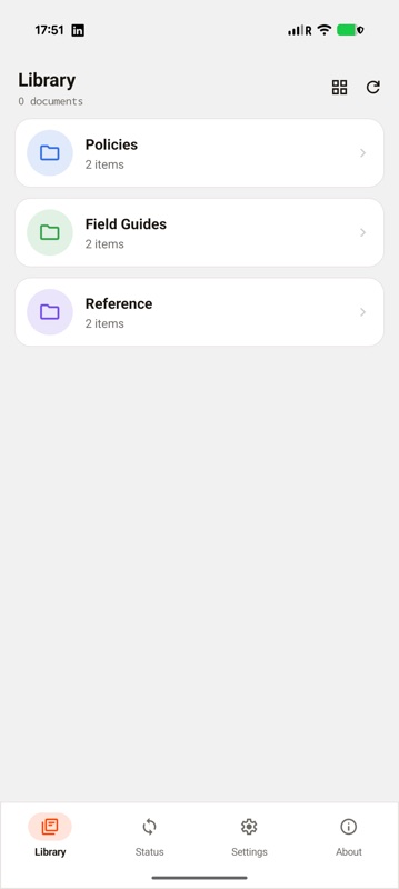 A DAG-built document app on a Pixel showing a library of three coloured folders - Policies, Field Guides and Reference - each listing two items, with a Library, Status, Settings and About tab bar.